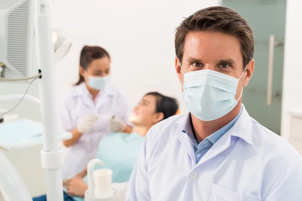 Dentist wearing protective mask