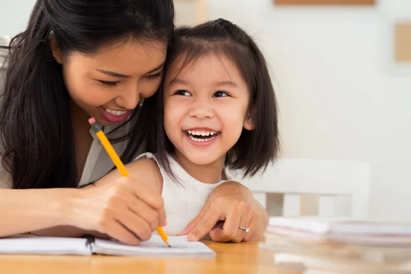 Mother and daughter drawing