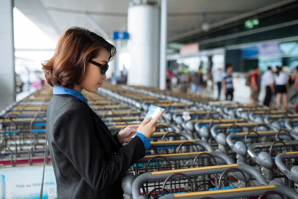 Business woman with flight ticket