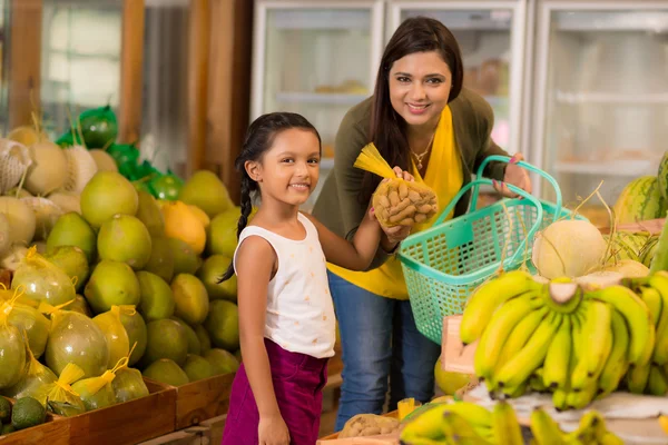 Mother and daughter at the grocery store