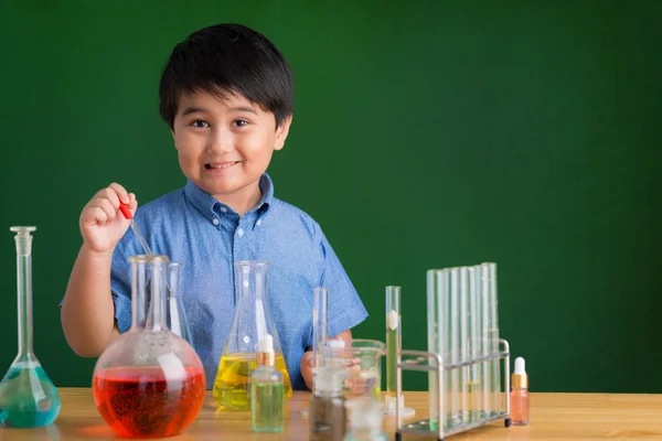 Boy  carrying out experiment