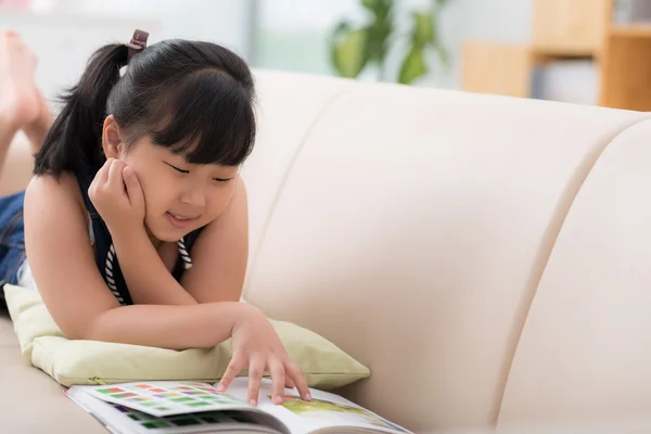 Vietnamese girl enjoying a book