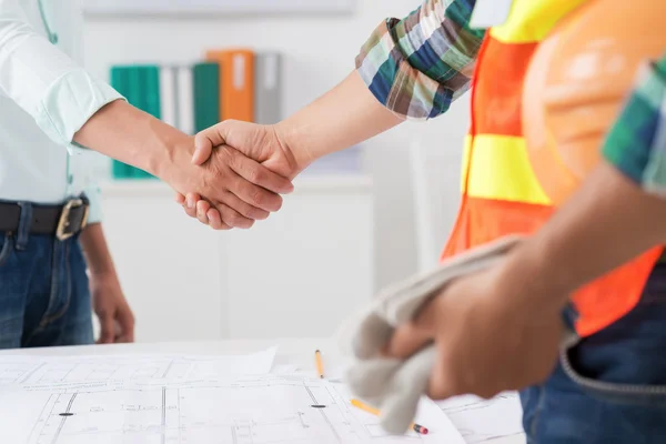 Engineer and investor shaking hands