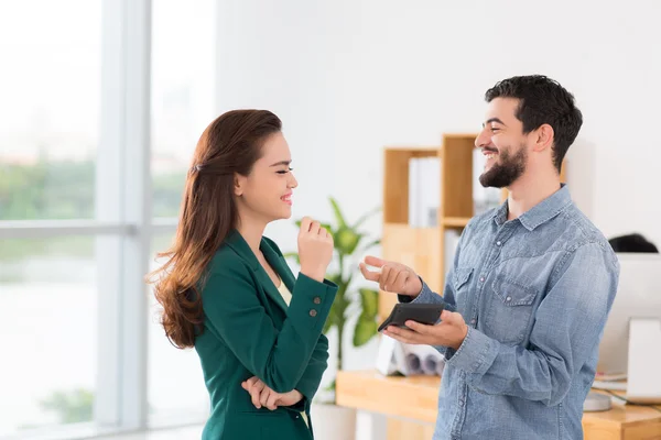 Business colleagues counting income