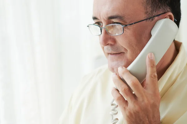 Man having telephone conversation