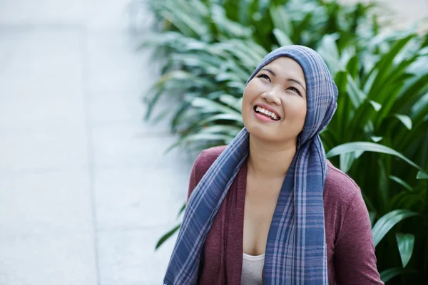 Cancer survivor in headscarf