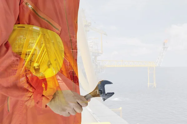 Worker and oil rig double exposure concept