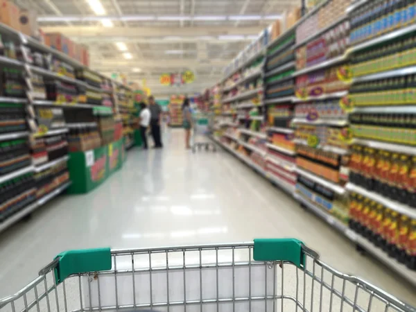 Blurred photo of store with trolley in department store