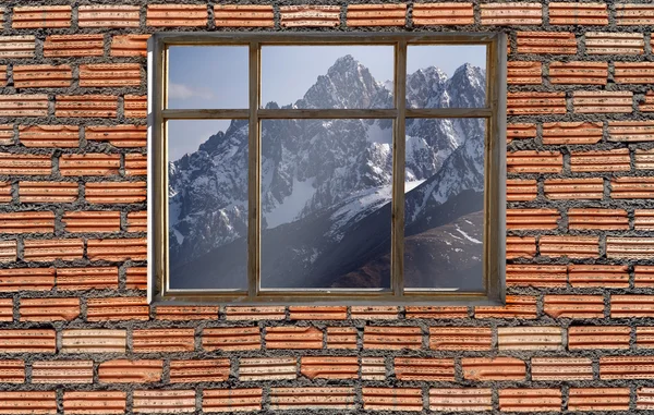 Snow mountain outside window with brick wall