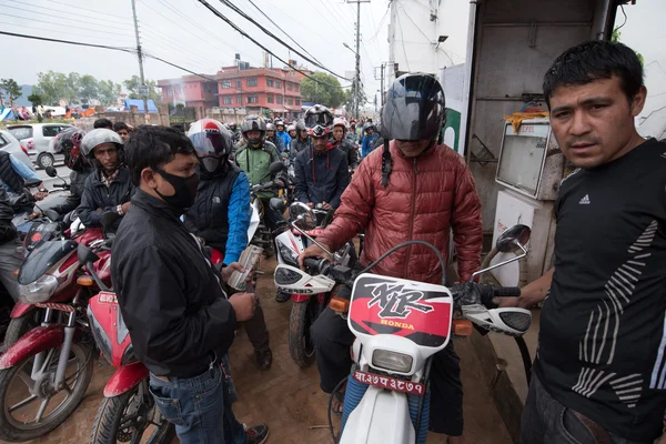 KATHMANDU, NEPAL APRIL 29: Nepalese queue at a gasoline station