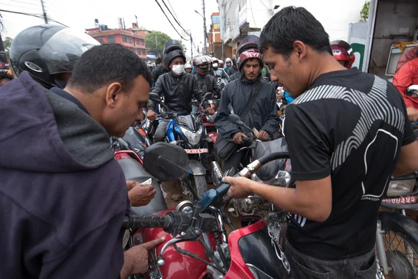 KATHMANDU, NEPAL APRIL 29: Nepalese queue at a gasoline station