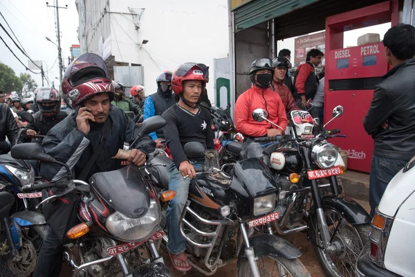 KATHMANDU, NEPAL APRIL 29: Nepalese queue at a gasoline station