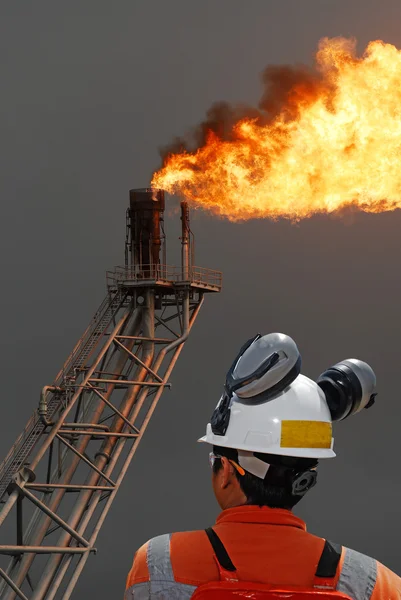 Oil worker and oil rig