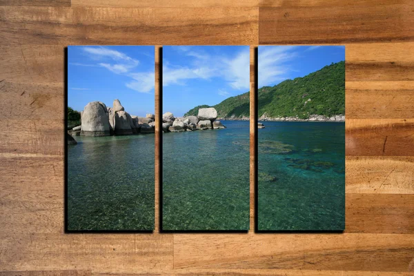 Seascape photo collage frame on wooden background