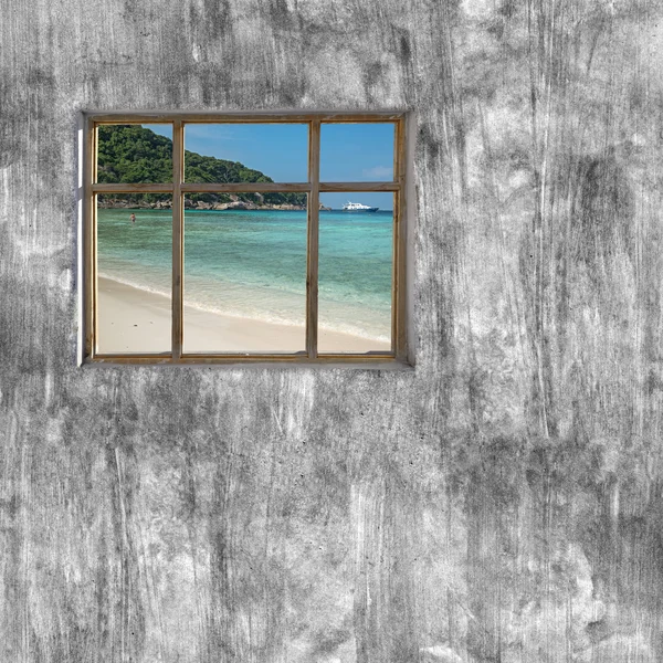 Windows frame on cement wall and view of seascape