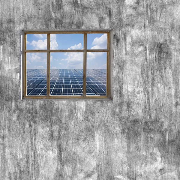 Windows frame on cement wall and view of solar cell panel