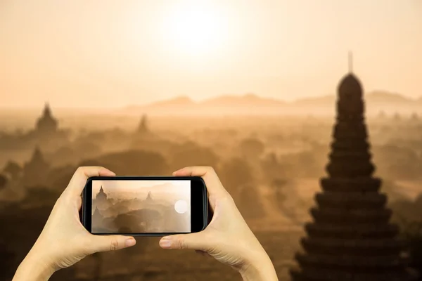 Bagan at sunrise, Mandalay, Myanmar. Taking photo on smart phone