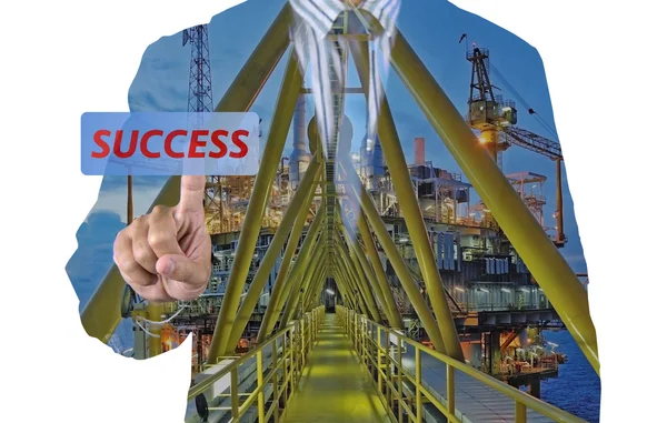 Businessman and oil rig double exposure concept