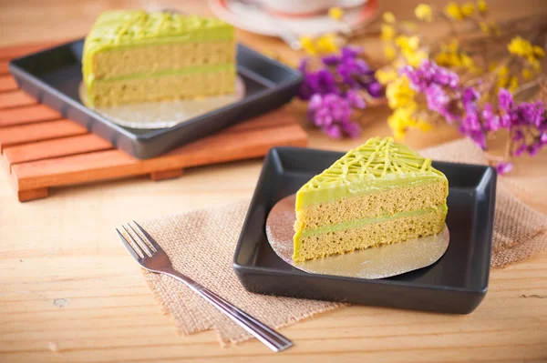 Green tea cake on wood table