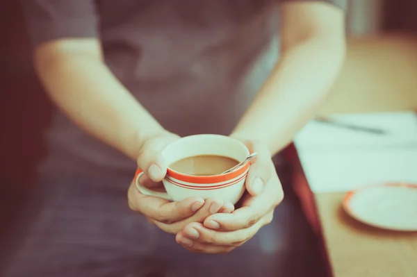 Coffee cup in male hand