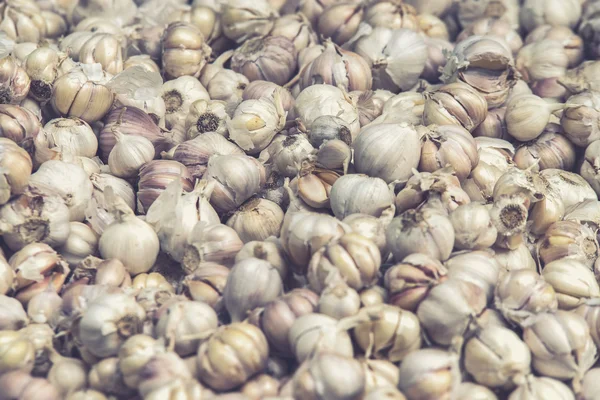 Group of garlic on market stand (Vintage filter effect used)