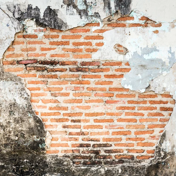 Old grunge brick wall fragment background.