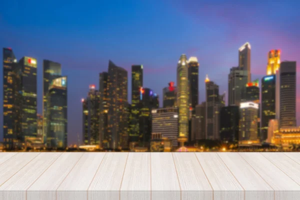 Perspective white wood table top with blurred modern cityscape