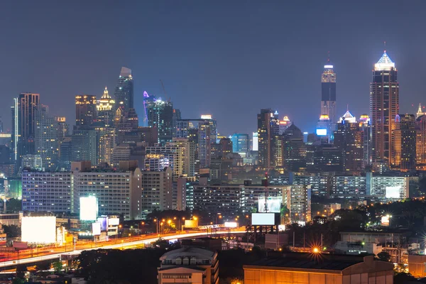 Modern office buildings, condominium in big city downtown with Expressway the infrastructure for transportation in modern city, urban view at twilight time