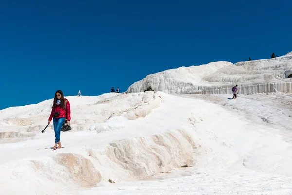 Tourists on Pamukkale travertines, Turkey.