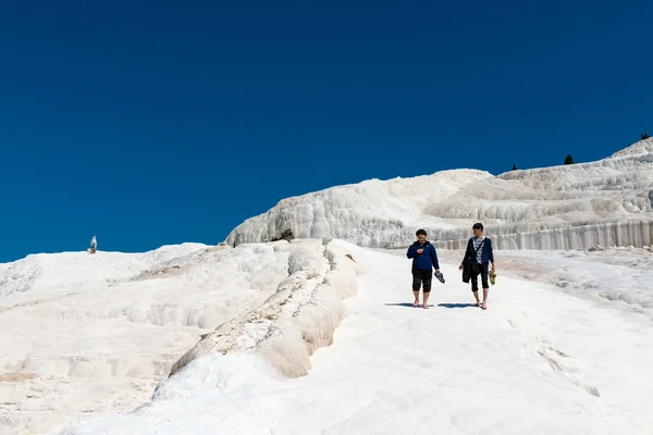 Tourists on Pamukkale travertines, Turkey.