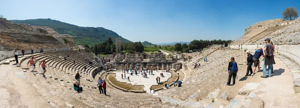 Tourists on Amphitheater (Coliseum) in Ephesus Turkey on April 13, 2015. Ephesus contains the ancient largest collection of Roman ruins in the eastern Mediterranean