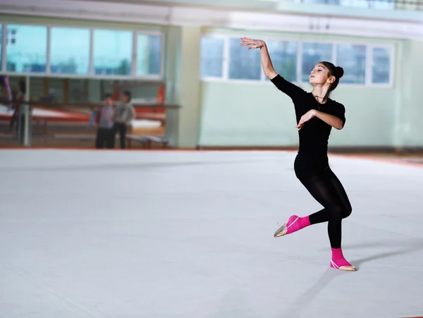 Girl dancing on training  rhythmic gymnastics