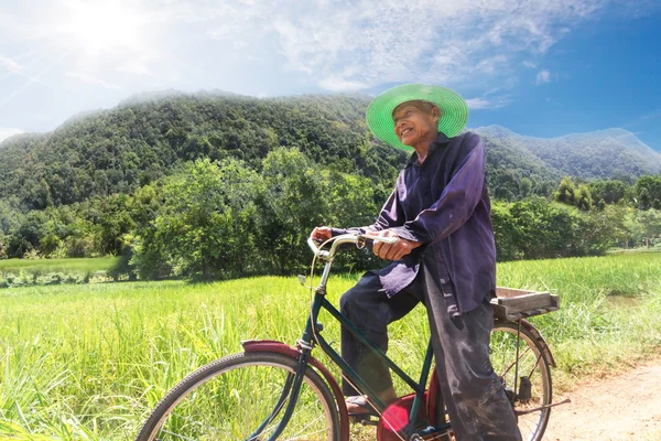 Older man on his bicycle in the countryside