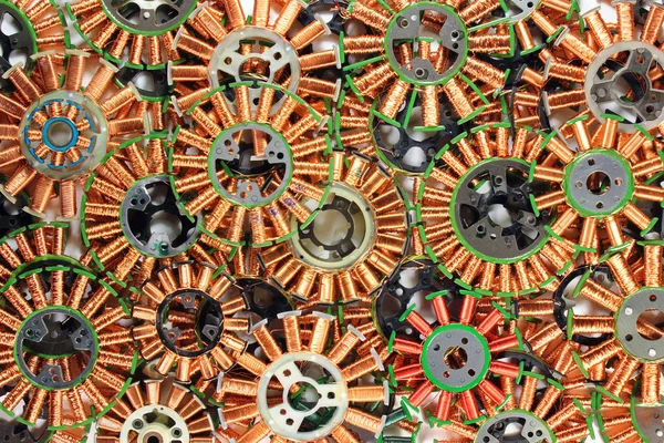 Parts of disassembled brushless dc electric motors. Colorful tec