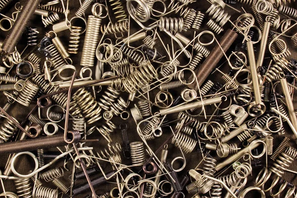 Many small metal springs as a background