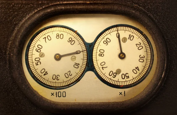 Old electromechanical counter - two dials and needles reading zeros