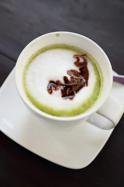 Cup of hot matcha green tea latte