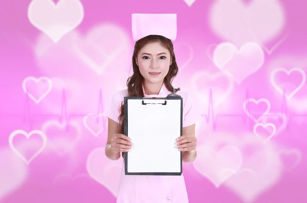 Female nurse with blank clipboard