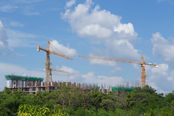 Industrial construction crane with the blue sky