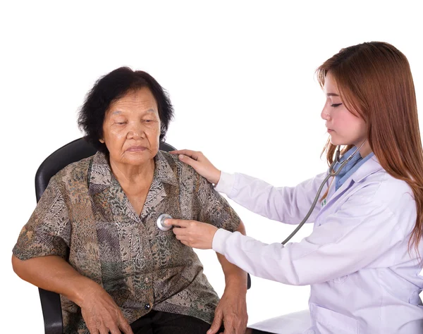 Doctor listening to elderly patient\'s heart