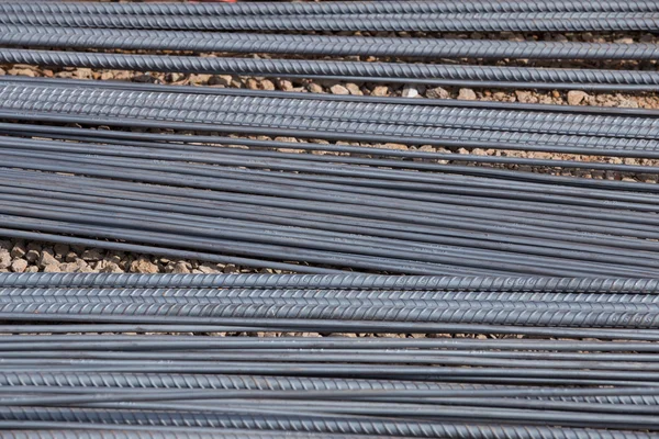 Steel rods or bars used to reinforce concrete