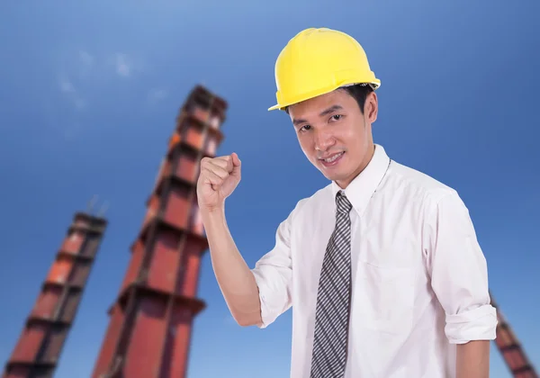 Happy engineer with arm raised, concept of successful, construct