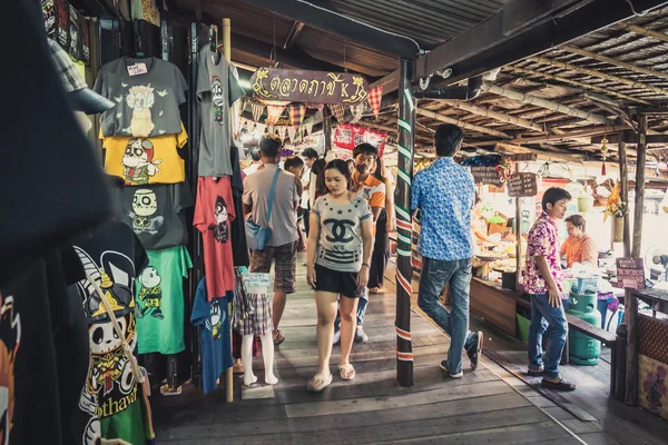 Phra Nakhon Si Ayutthaya, Thailand - April 14, 2015: Ayothaya Floating Market. Has a many visitors, both Thais and foreign visitors with varieties of Thai clothes and Thai food at Ayutthaya,Thailand