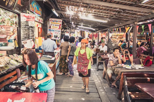 Phra Nakhon Si Ayutthaya, Thailand - April 14, 2015: Ayothaya Floating Market. Has a many visitors, both Thais and foreign visitors with varieties of Thai clothes and Thai food at Ayutthaya,Thailand