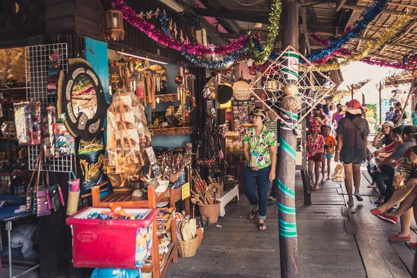 Phra Nakhon Si Ayutthaya, Thailand - April 14, 2015: Ayothaya Floating Market. Has a many visitors, both Thais and foreign visitors with varieties of Thai clothes and Thai food at Ayutthaya,Thailand