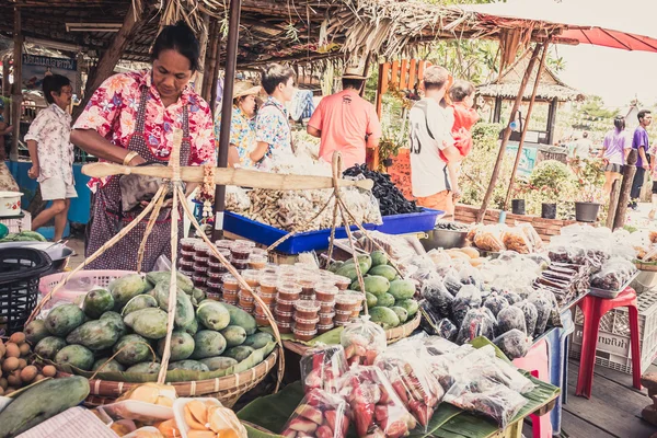 Phra Nakhon Si Ayutthaya, Thailand - April 14, 2015: Ayothaya Floating Market. Has a many visitors, both Thais and foreign visitors with varieties of Thai clothes and Thai food at Ayutthaya,Thailand