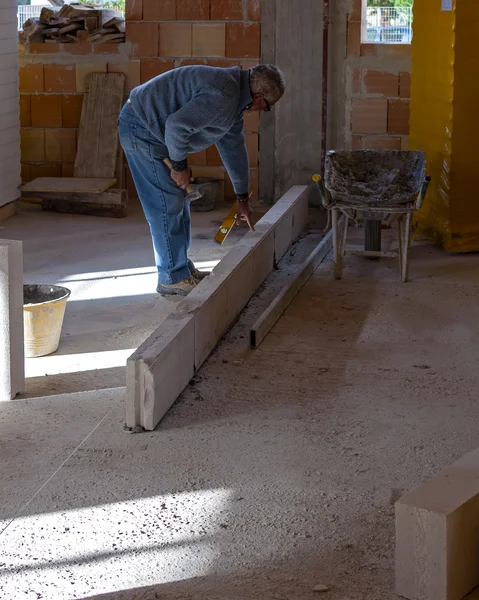 Worker performs an internal bricklayer wall