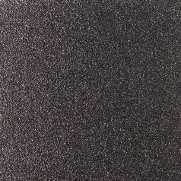 Background texture of a shiny metal sheet with a rough stippled