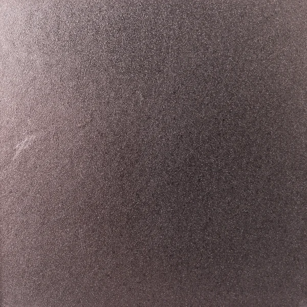 Background texture of a shiny metal sheet with a rough stippled
