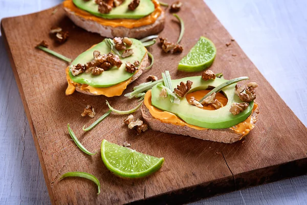 Sandwiches with avocado and nuts